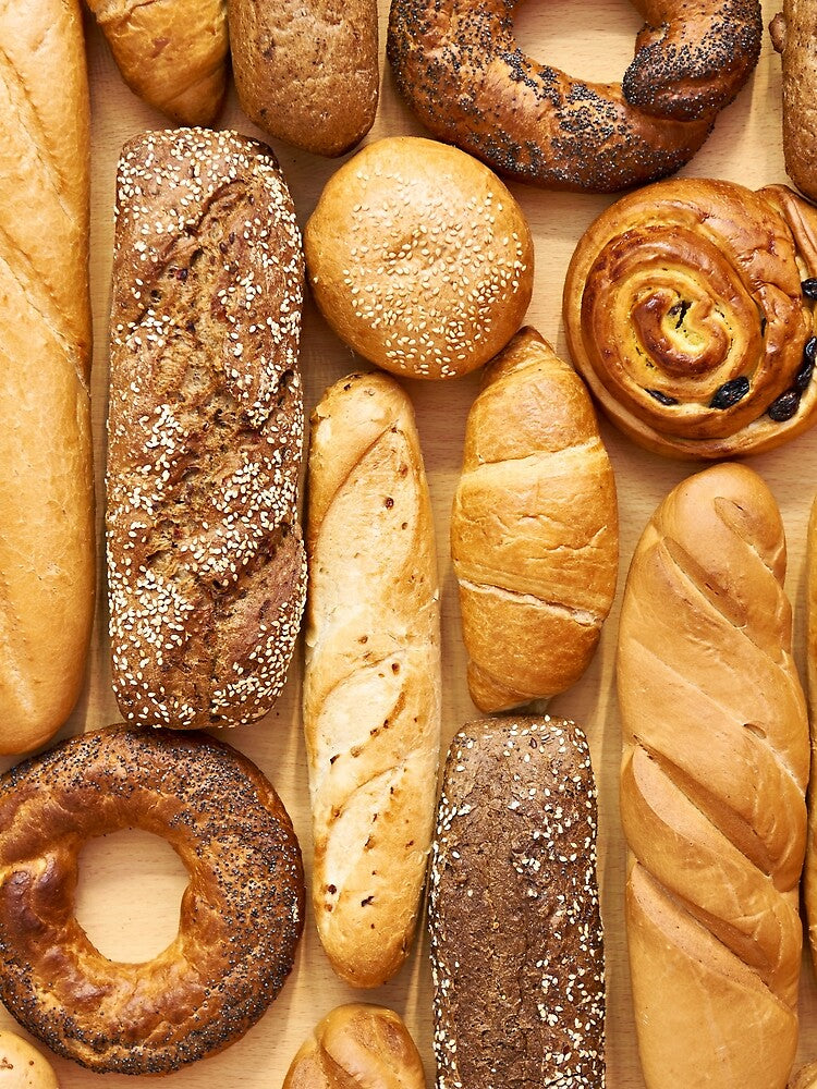 Bread baking rolls and croissants background by Ryzhov